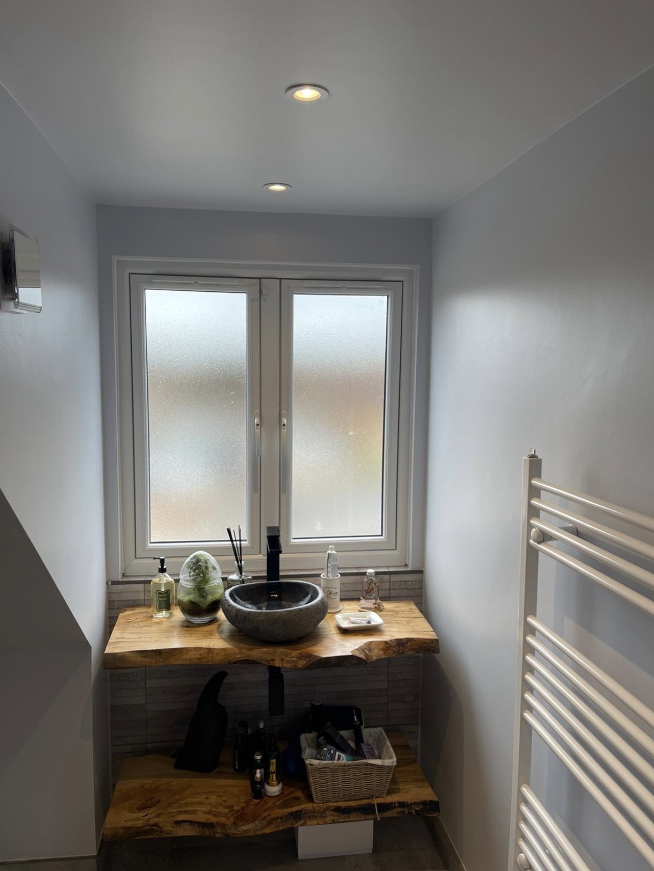 Newly finished bathroom with timber vanity shelf and stone countertop basin — bathroom decorating by MNC Construction, Essex