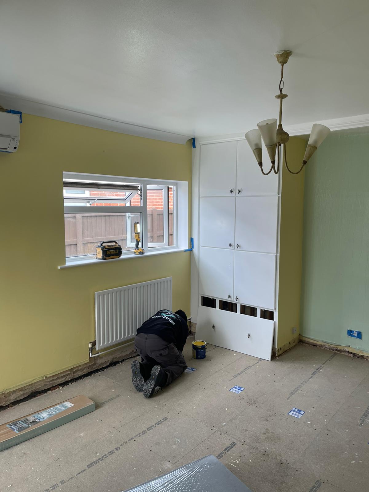 Fitted wardrobe unit and freshly painted room — interior painting and fitting by MNC Construction, Billericay, Essex